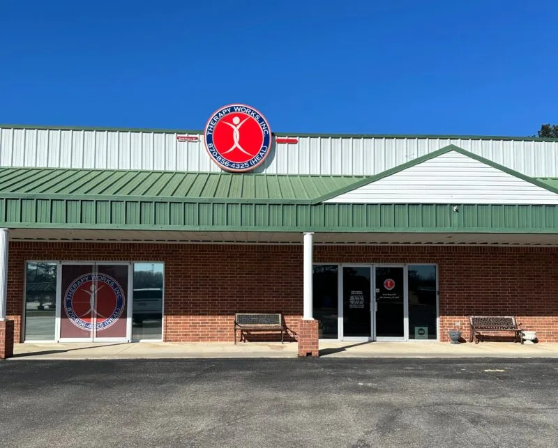 Therapy center building exterior with logo and windows.